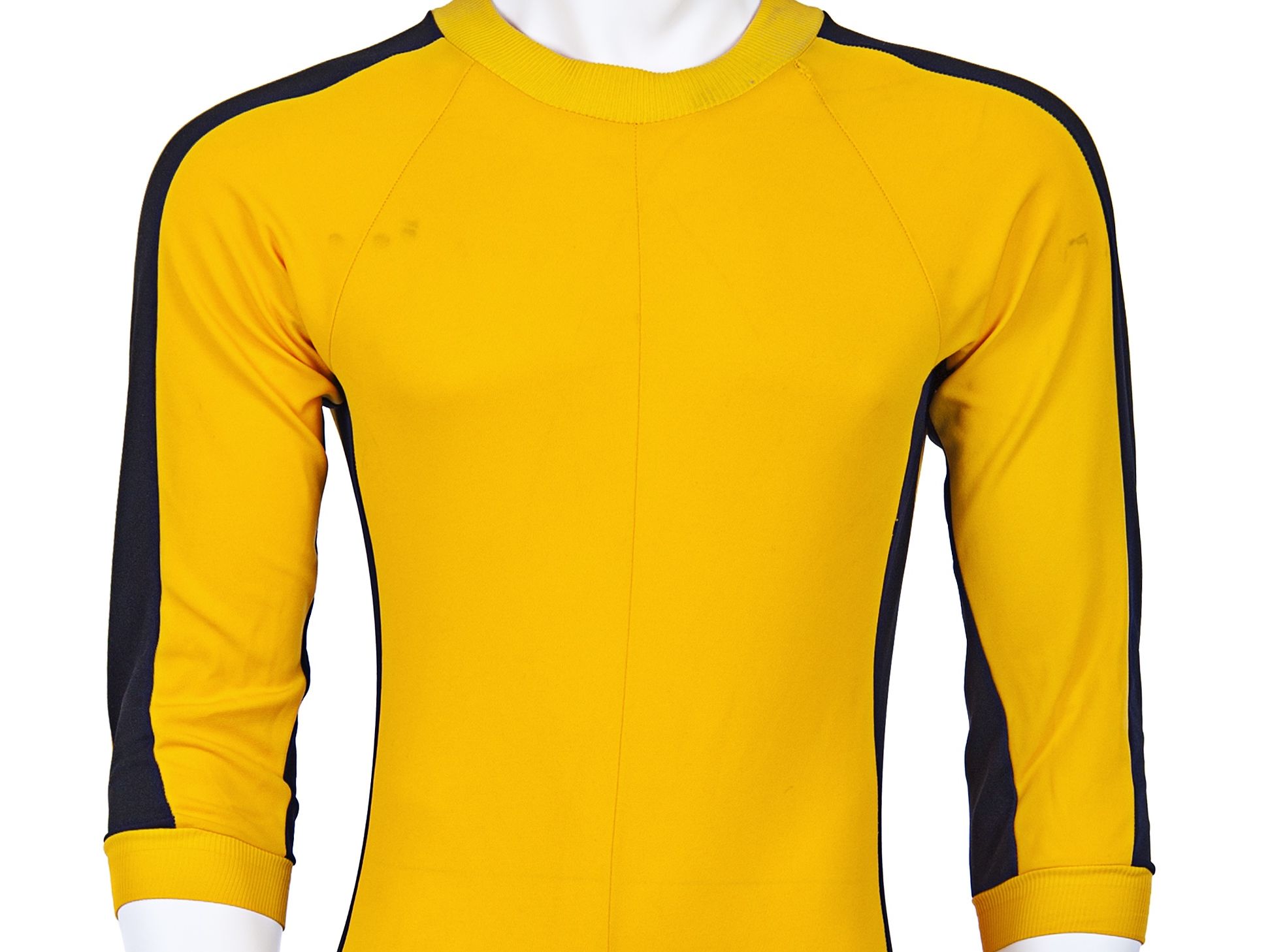 Bruce Lee's iconic jumpsuit fetches $100,000 at auction | CNN