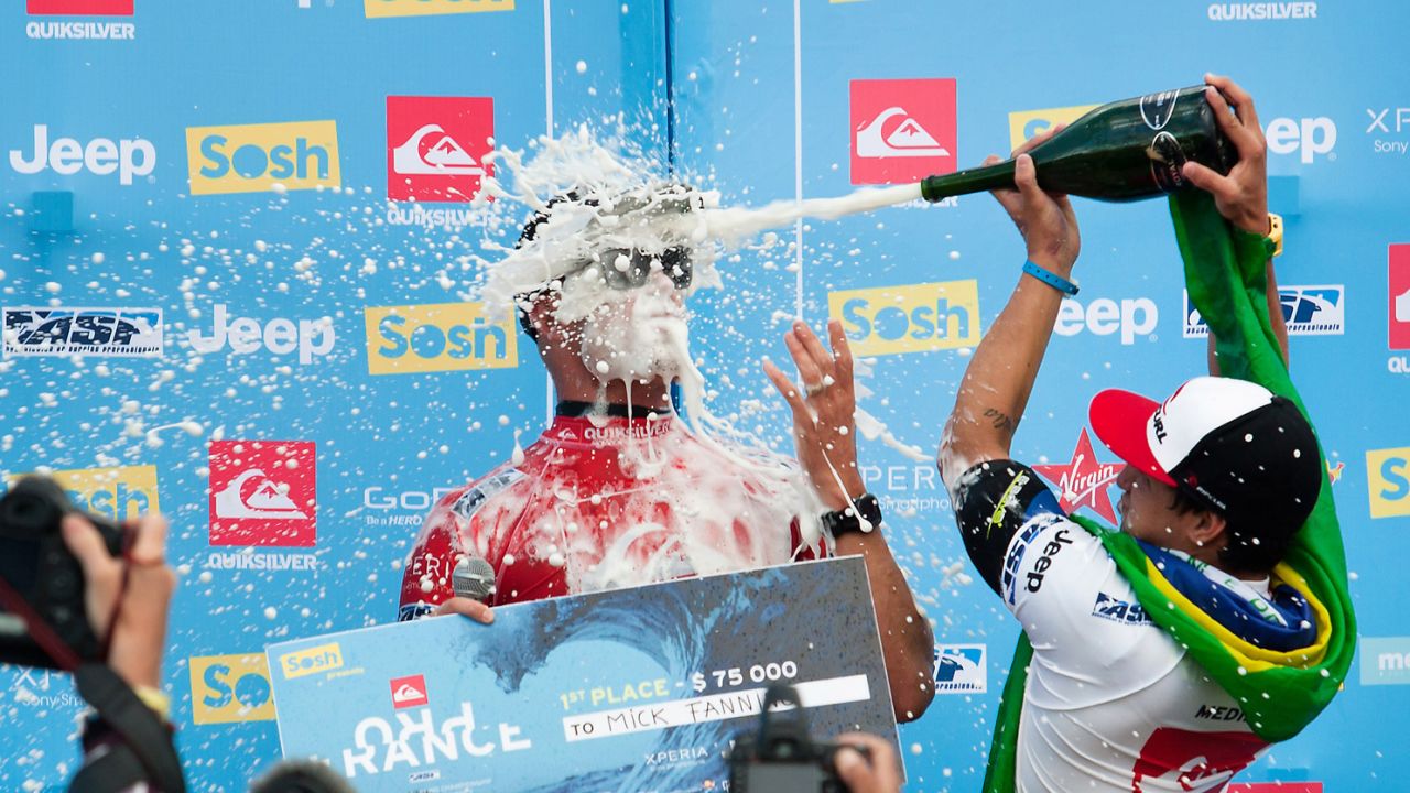 Surfer Mick Fanning of Australia, left, celebrates winning the Quiksilver Pro France after defeating Gabriel Medina of Brazil on October 4 in Hossegor, France.