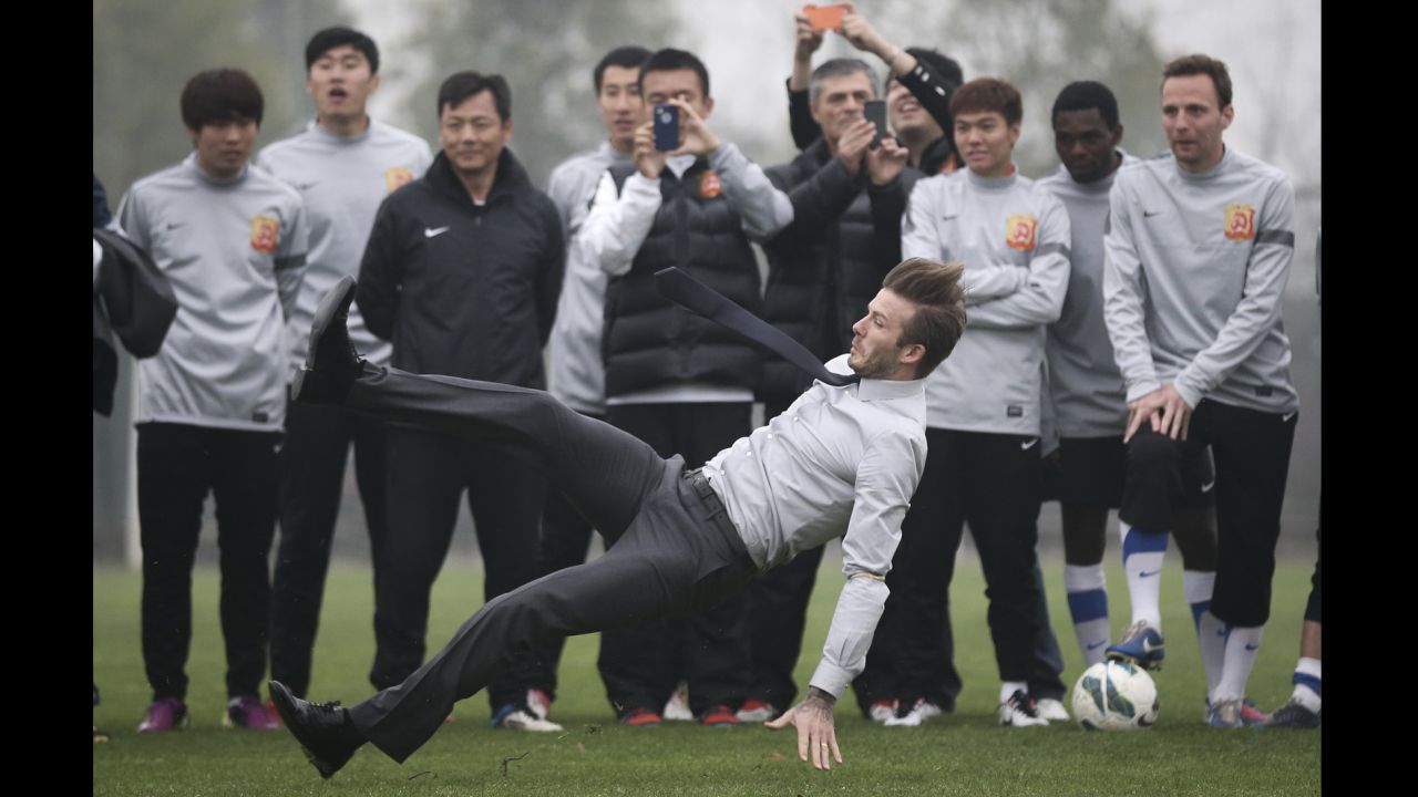 David Beckham falls during his visit with the Wuhan Zall Football Club on March 23 in Wuhan, China.
