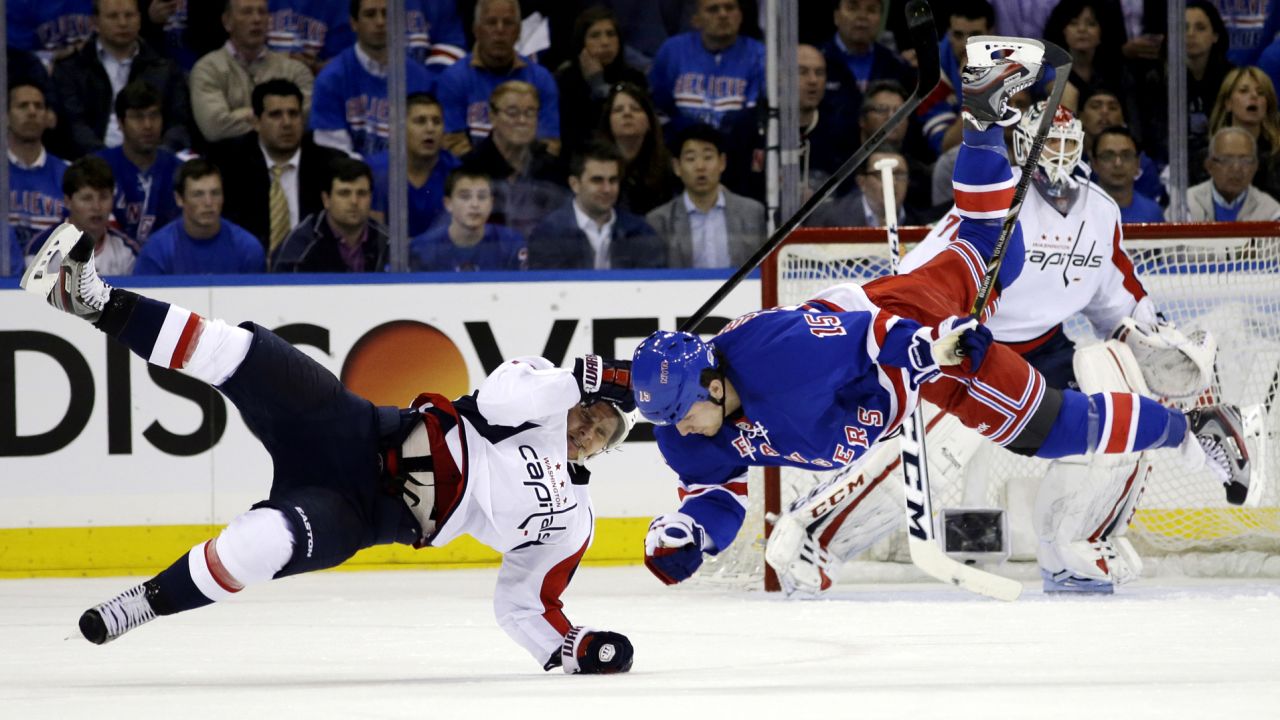 Washington Capitals left wing Martin Erat and New York Rangers right wing Derek Dorsett are upended after colliding in Game 3 of their first-round Stanley Cup playoff series in New York on May 6. The Rangers won 4-3.