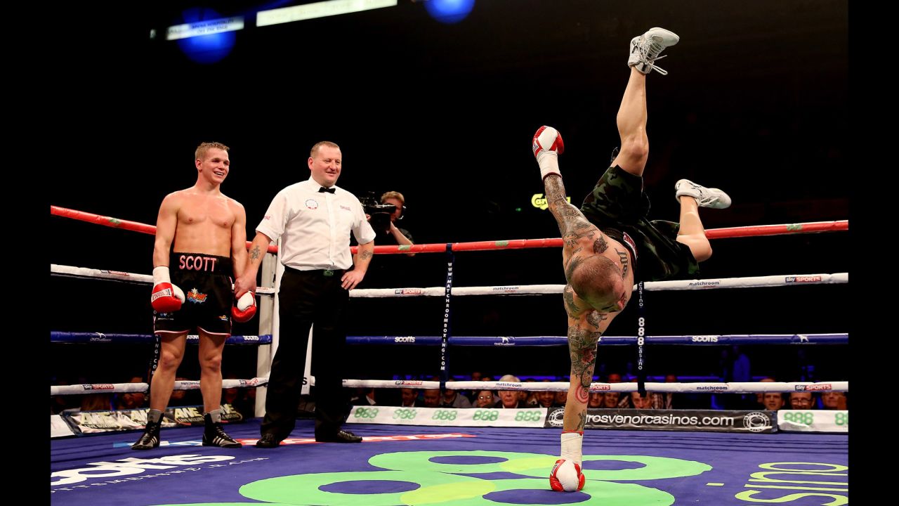Antonio Rodriguez dances in the ring as Scott Jenkins celebrates his victory during their lightweight bout on October 26 at Motorpoint Arena in Sheffield, England.