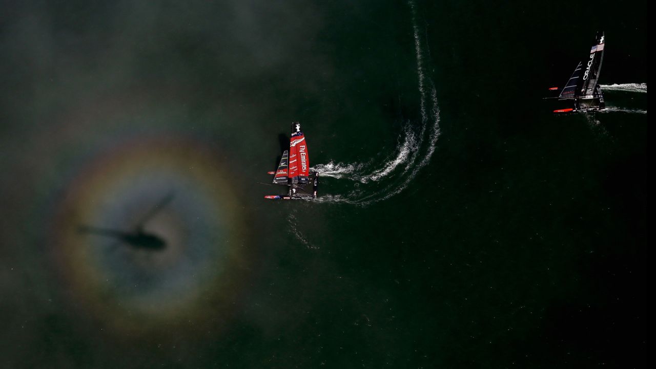 Light refracts off fog and creates a rainbow halo around a helicopter's shadow while Emirates Team New Zealand races against Oracle Team USA in the finals of America's Cup on September 12 in San Francisco, California. Emirates Team New Zealand won the race.