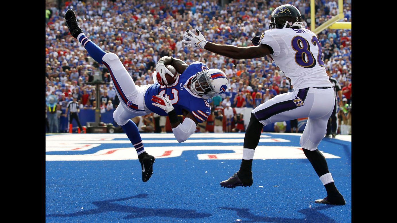 Buffalo Bills free safety Aaron Williams intercepts a pass intended for Baltimore Ravens wide receiver Torrey Smith during the second half of their game in Orchard Park, New York, on September 29. The Bills won 23-20.