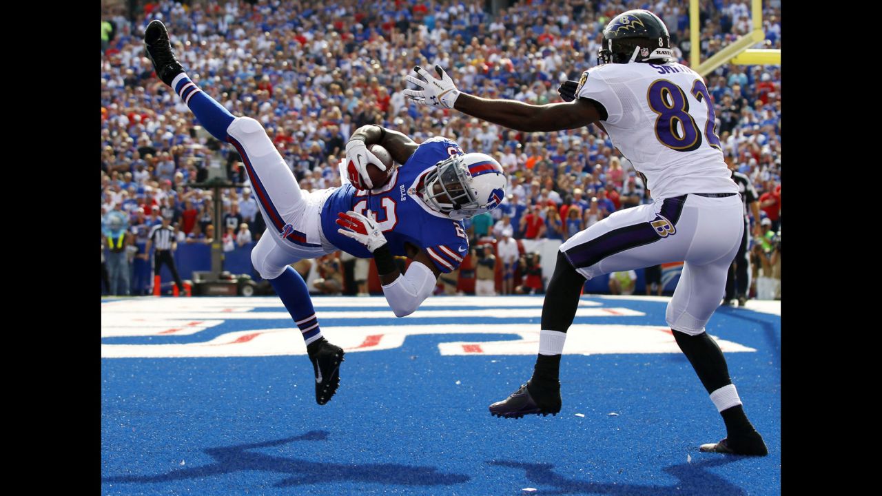 Buffalo Bills free safety Aaron Williams intercepts a pass intended for Baltimore Ravens wide receiver Torrey Smith during the second half of their game in Orchard Park, New York, on September 29. The Bills won 23-20.