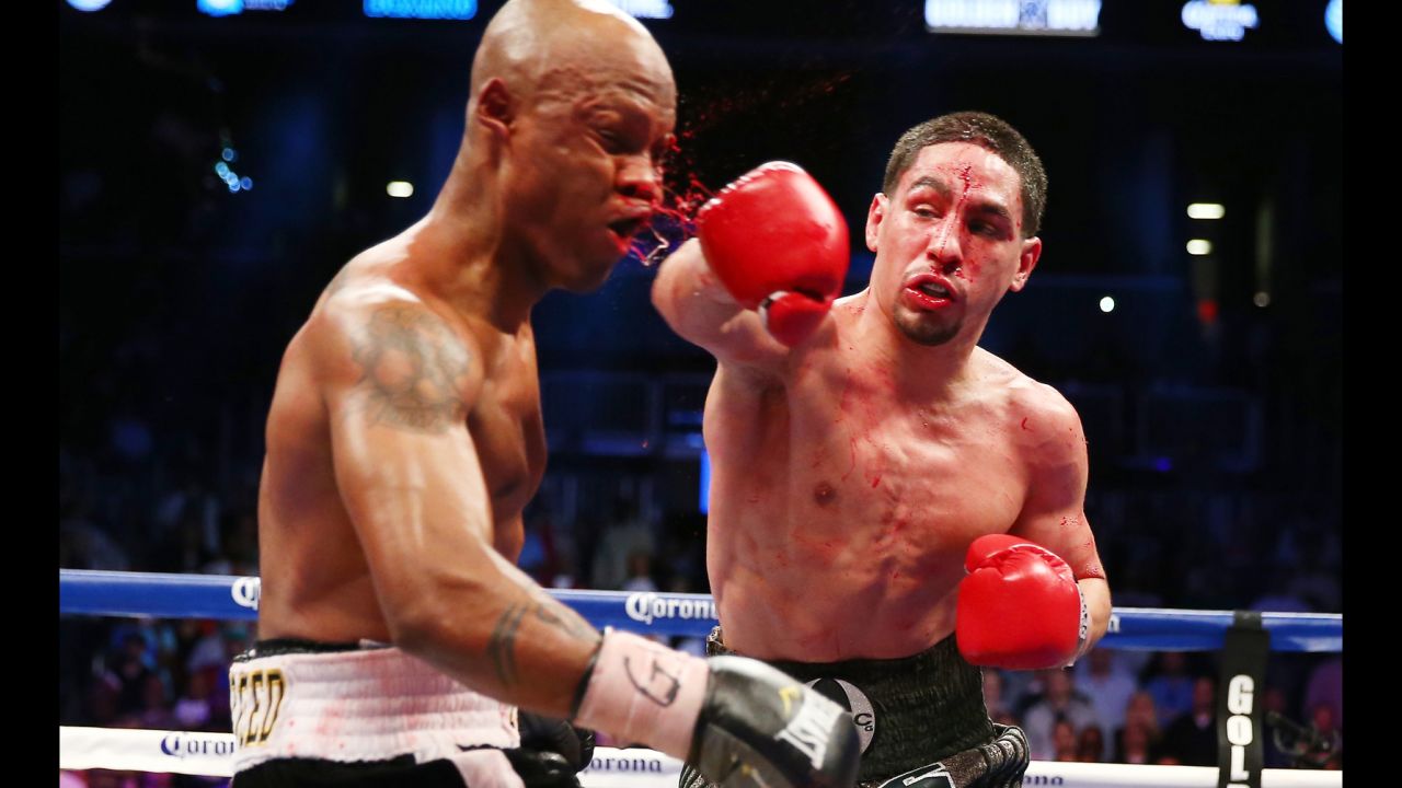 Danny Garcia punches Zab Judah during the WBA Super and WBC Super Lightweight title fight at Barclays Center in Brooklyn, New York, on April 27. Garcia was declared the winner after 12 rounds.