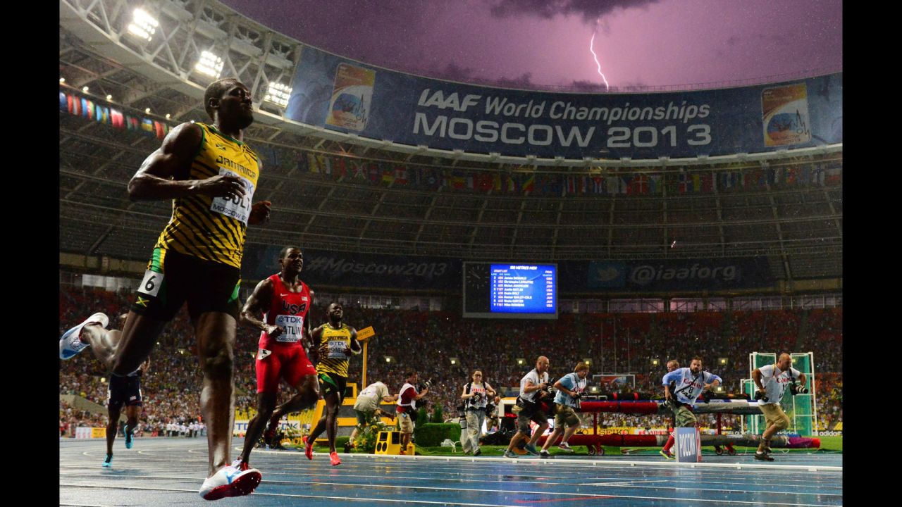 A lightning bolt strikes as Usain Bolt of Jamaica wins the 100-meter final in the IAAF World Championships on August 11 at Luzhniki Stadium in Moscow. Bolt timed a season's best 9.77 seconds.