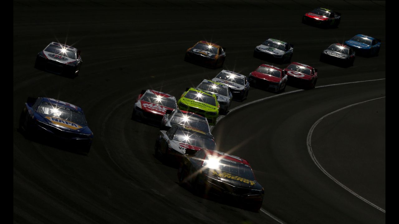Martin Truex Jr., driver of the No. 56 NAPA Auto Parts Toyota, races Clint Bowyer, driver of the No. 15 5-hour Energy Toyota, during the NASCAR Sprint Cup Series Auto Club 400 on March 24 at the Auto Club Speedway in Fontana, California.