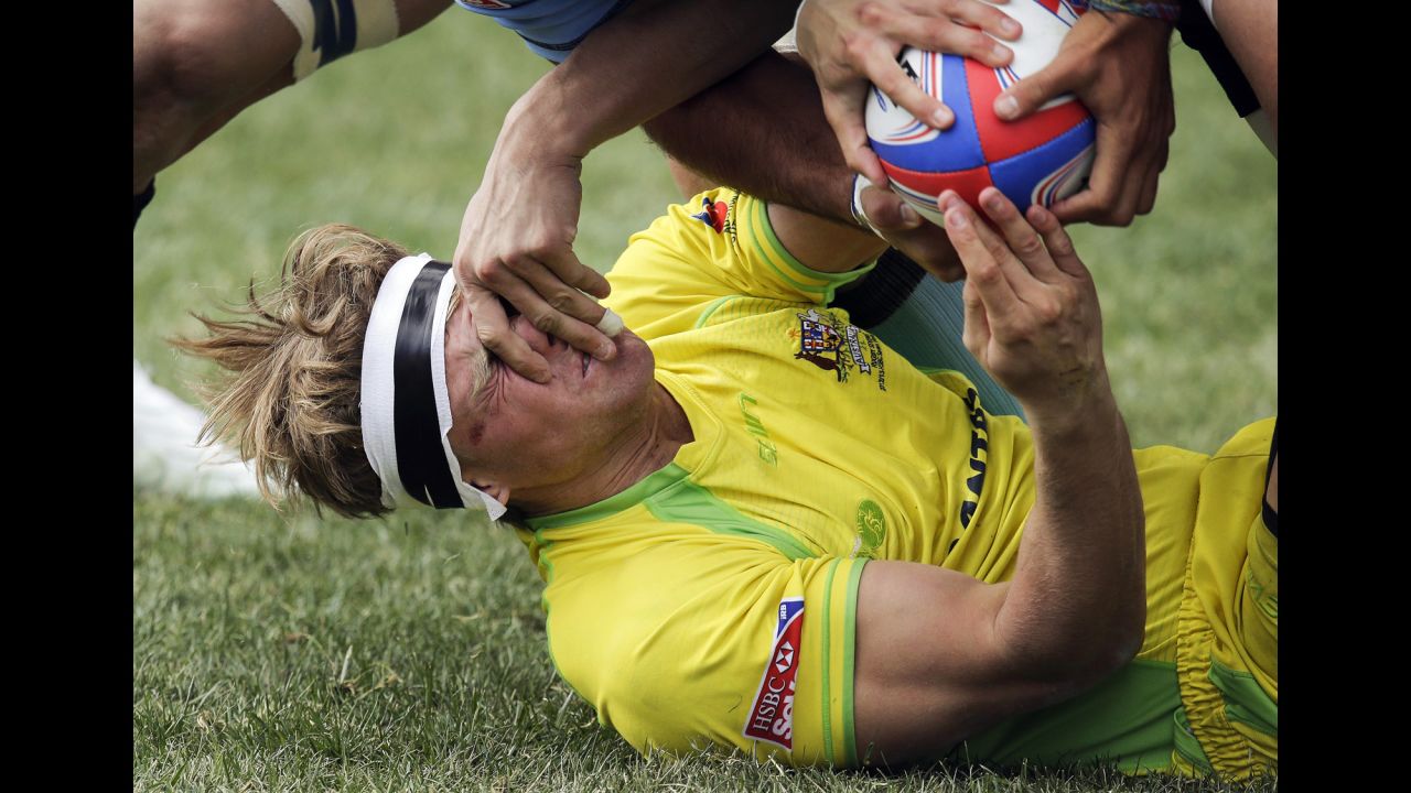 Australia's Lewis Holland tries to hand the ball off to a teammate during the Shield Final match against Uruguay in the Sevens Rugby World Series on February 10 in Las Vegas. Australia won 41-0.