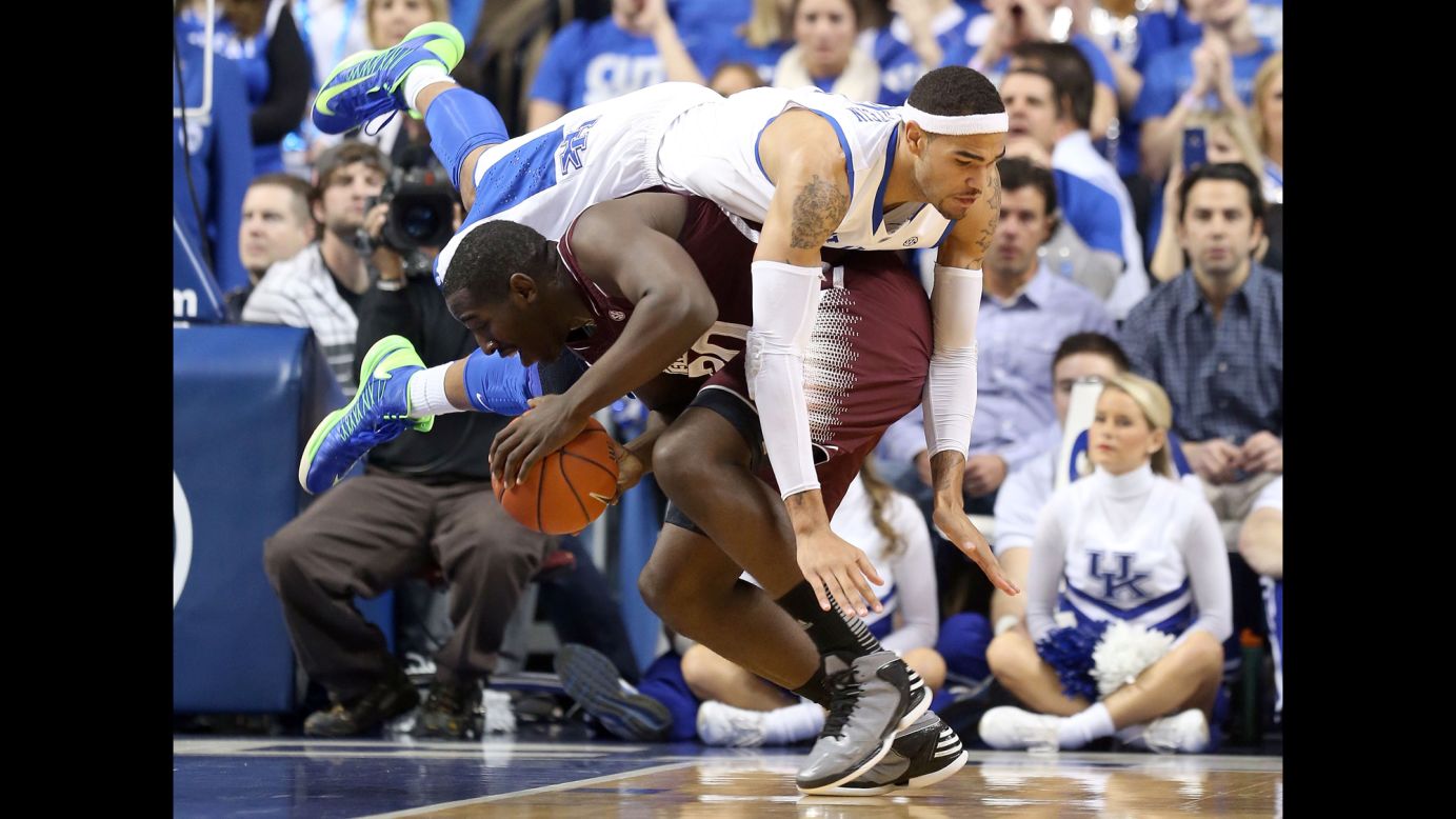 Willie Cauley-Stein of the Kentucky Wildcats lands on Gavin Ware of the Mississippi State Bulldogs during a game at Rupp Arena in Lexington, Kentucky, on February 27. Kentucky won 85-55.