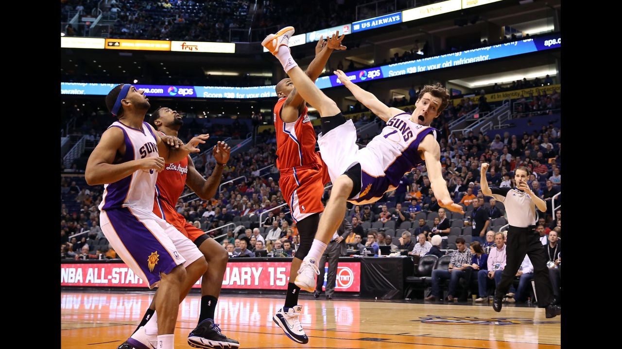 Goran Dragic of the Phoenix Suns falls to the court after being fouled by Caron Butler of the Los Angeles Clippers on January 24 at US Airways Center in Phoenix. The Suns won 93-88.
