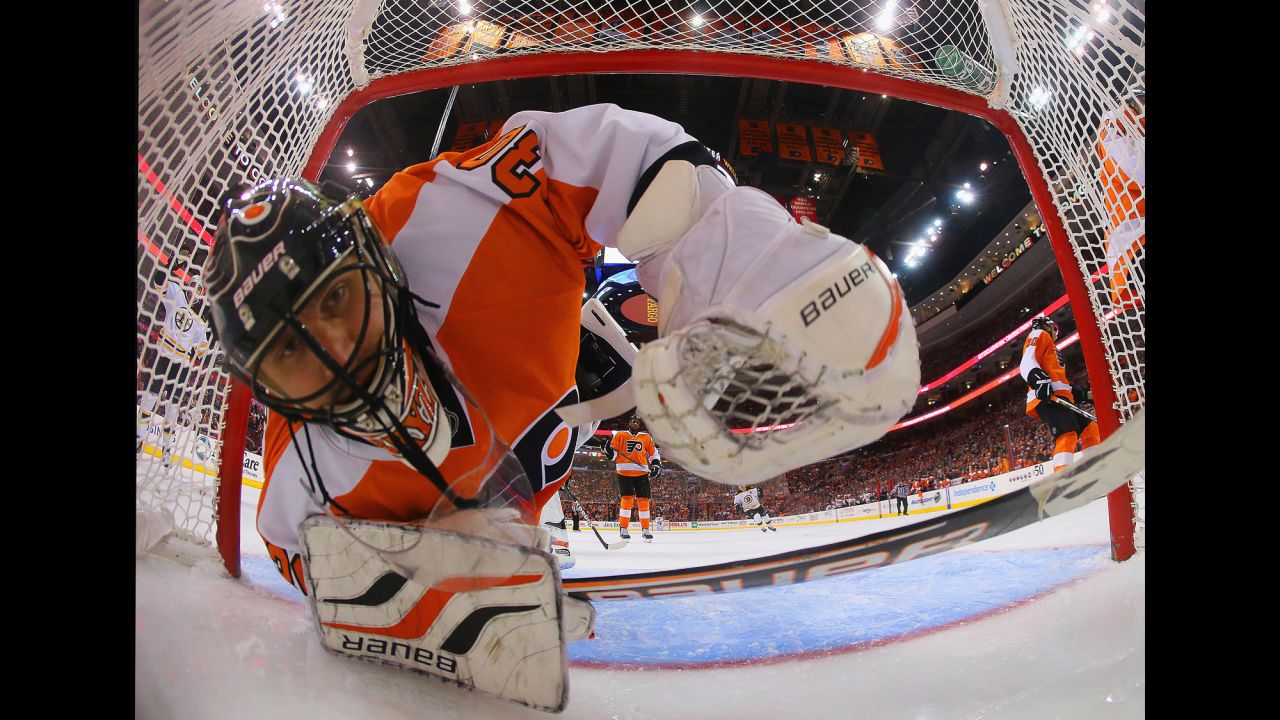 Ilya Bryzgalov of the Philadelphia Flyers looks back in the net after a goal by Nathan Horton of the Boston Bruins on March 30 in Philadelphia, as seen through a wide angle lens. The Flyers defeated the Bruins 3-1.