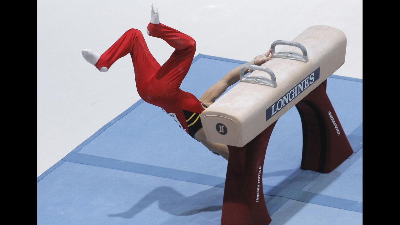 Gymnast Daan Kenis of Belgium falls off the pommel horse during the qualification round for the World Artistic Gymnastics Championships in Antwerp, Belgium, on September 30.