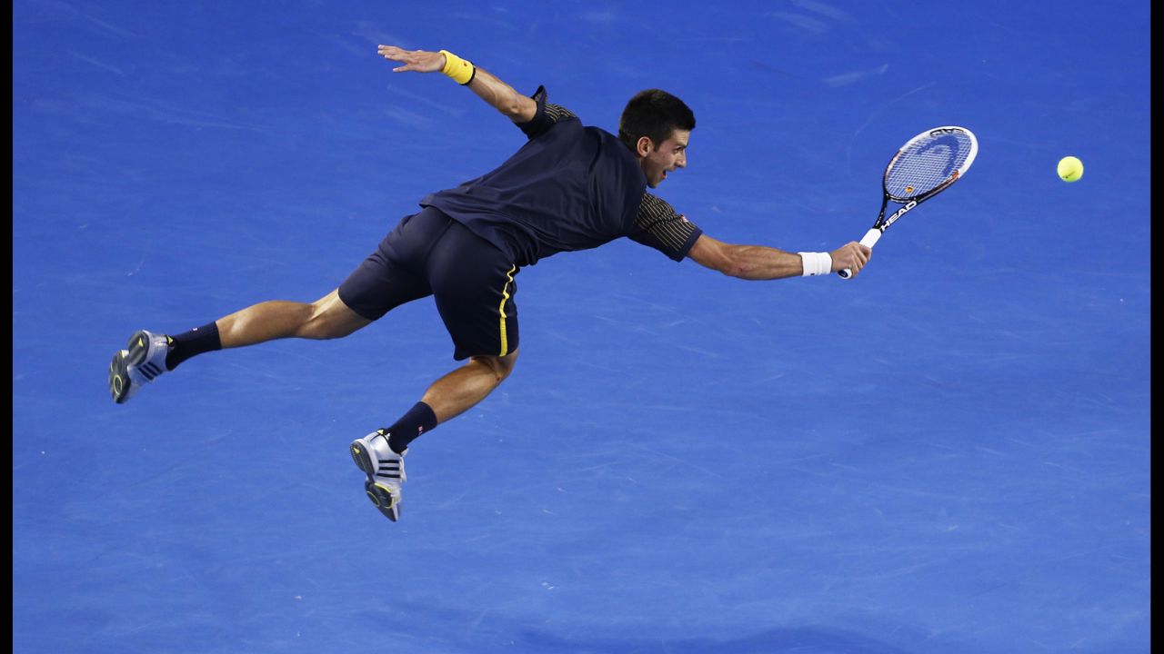 Novak Djokovic of Serbia hits a backhand during the men's final against Andy Murray of Great Britain at the Australian Open Grand Slam tennis tournament on January 27 in Melbourne, Australia.