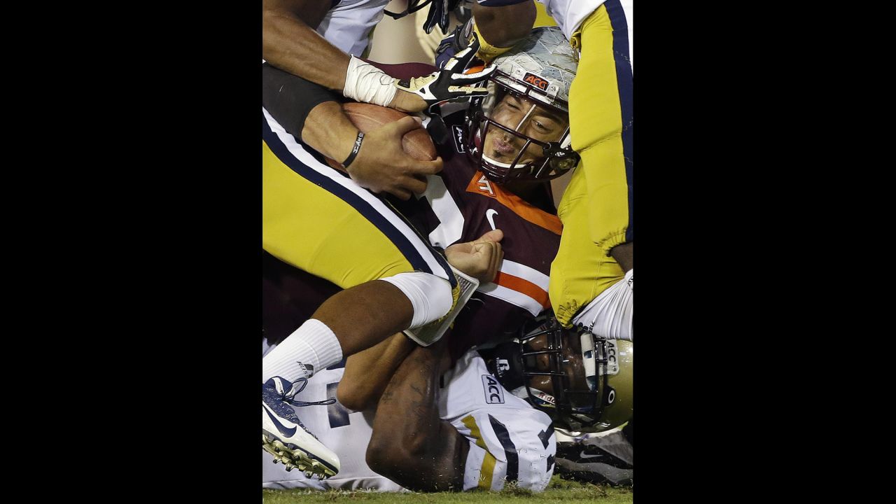 Virginia Tech quarterback Logan Thomas is stopped by the Georgia Tech defense after a short gain in the first half on September 26 in Atlanta. Virginia Tech won 17-10.