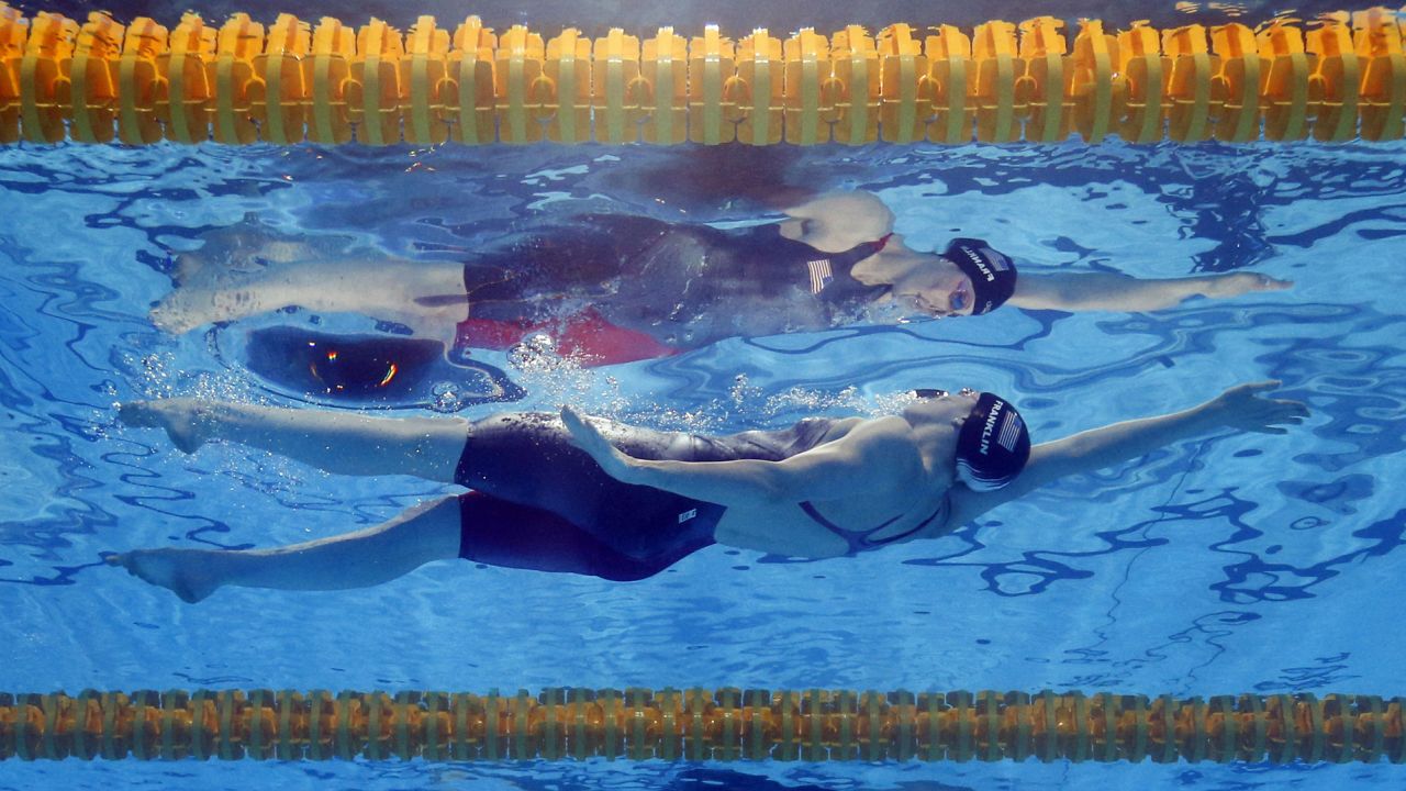 Missy Franklin of the United States is reflected in the water as she swims to the gold medal in the women's 100-meter backstroke at the FINA Swimming World Championships in Barcelona on July 30.