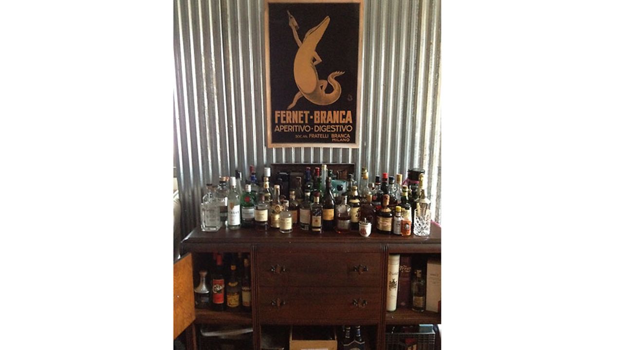 Steva Casey, bar manager at Veranda on Highland in Birmingham, Alabama, made a bar from an antique sideboard placed close to her kitchen for maximum entertaining potential.