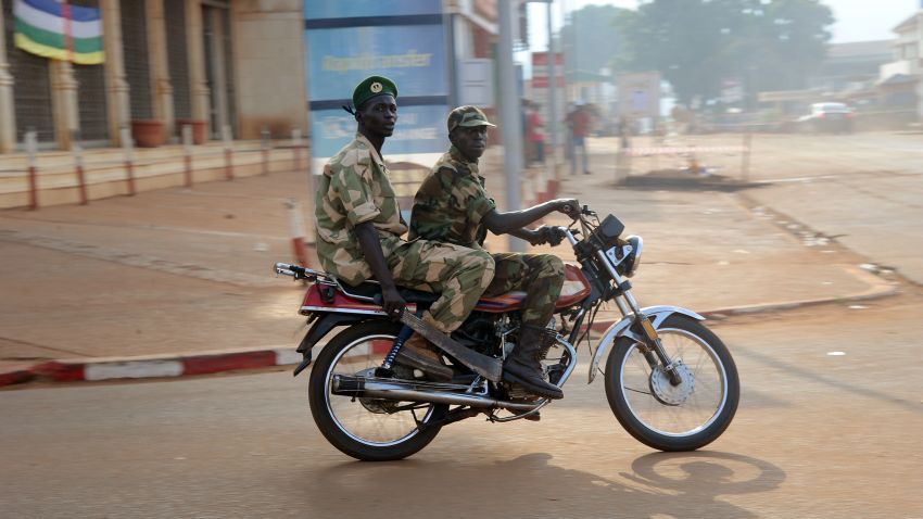 Soldiers patrol on December 5, 2013 in a street of Bangui as shots rang out and blasts from heavy weapons rocked several districts of the Central African Republic capital.