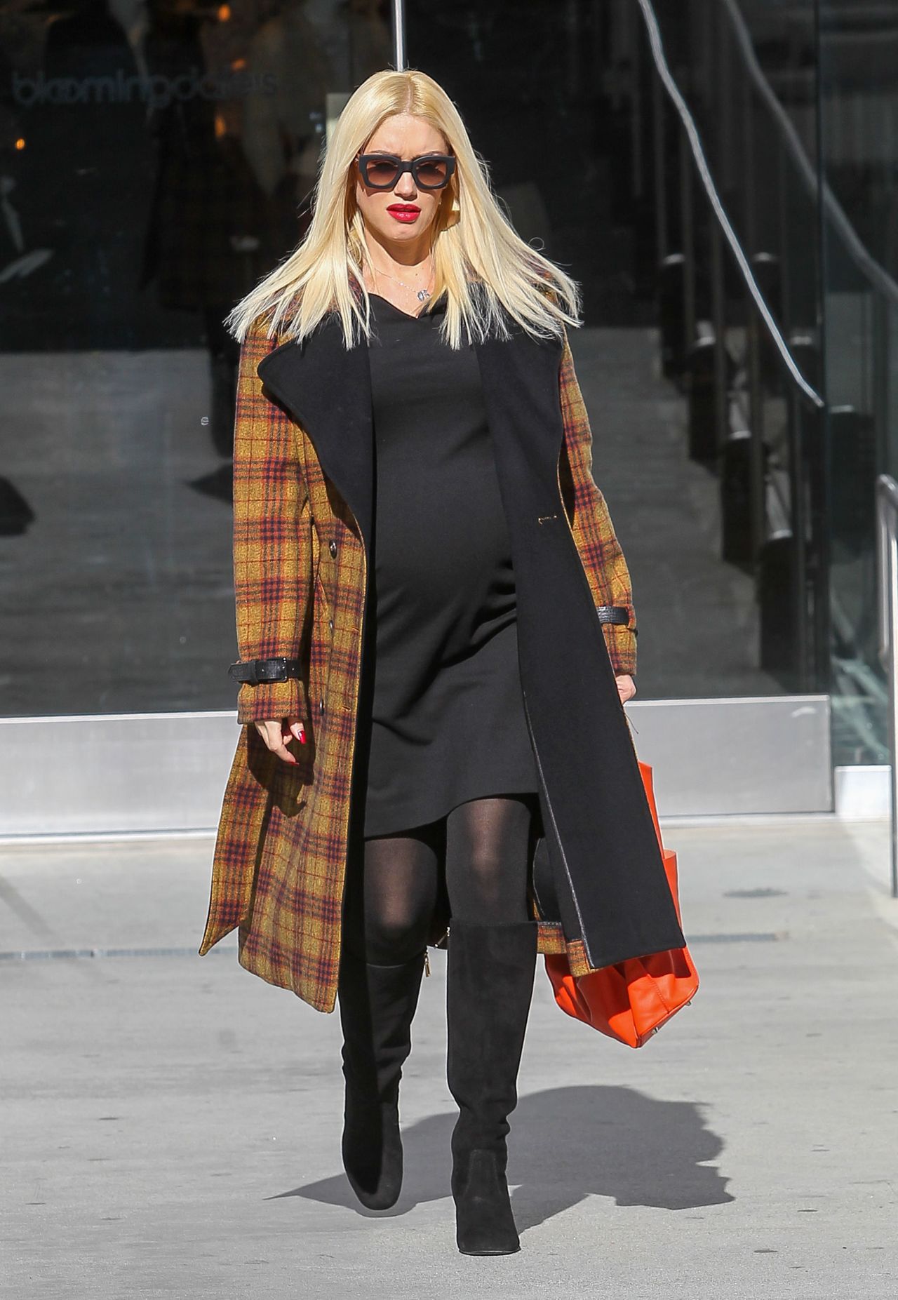 Gwen Stefani dresses her baby bump for chillier weather on December 5.