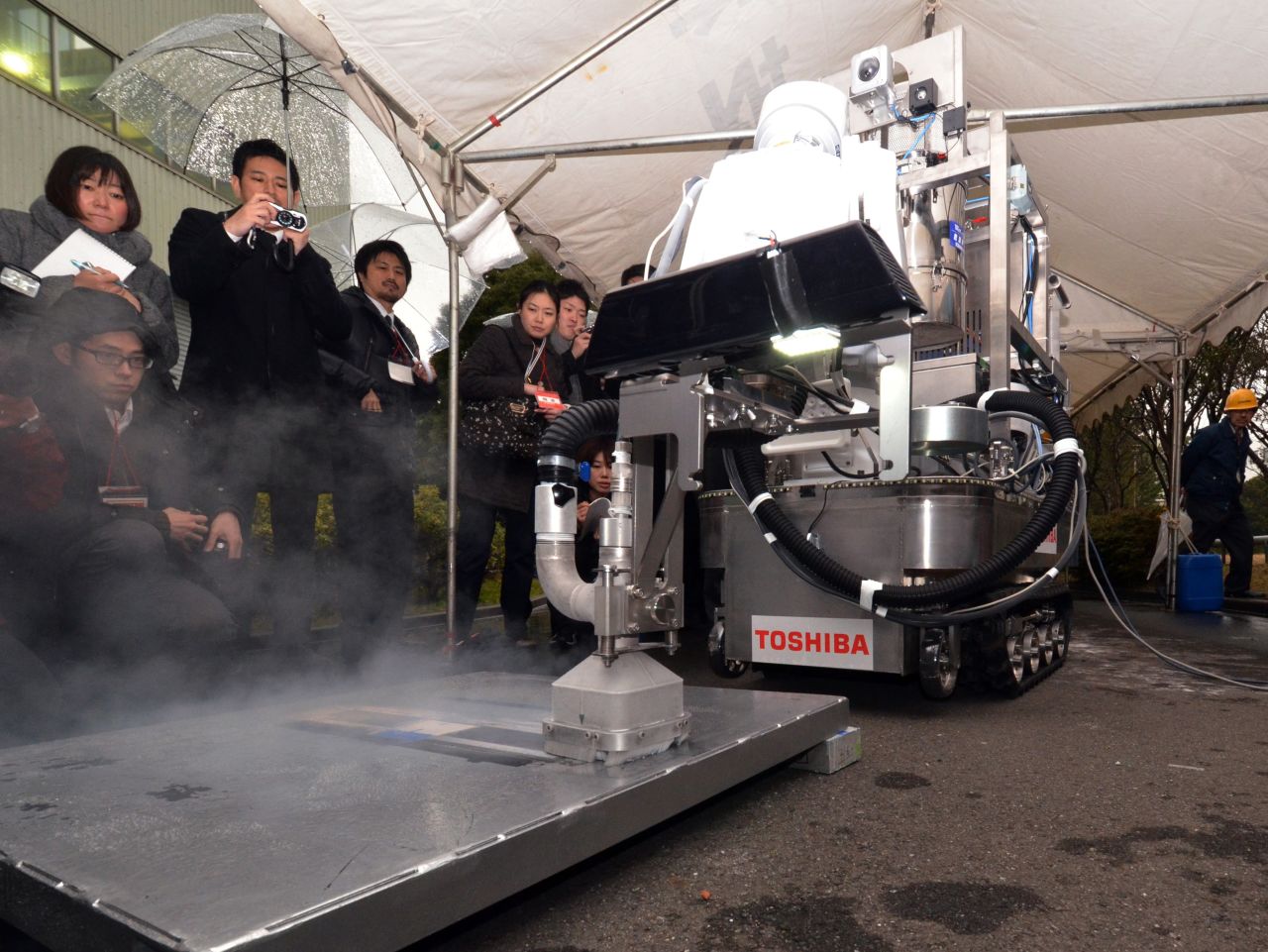 This Toshiba decontamination robot blasts dry ice particles against contaminated floors or walls and can be used to quickly and effectively clean up chemical spillages at nuclear plants. 