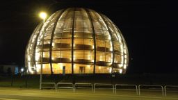 The Large Hadron Collider is located at CERN, the European Organization for Nuclear Research. This is CERN's Globe of Science and Innovation, which hosts a small museum about particle physics inside.