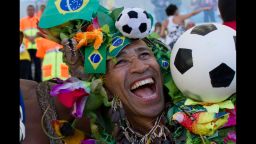 A Brazilian fan laughs at Maracana stadium before a FiFA World Cup Brazil 2014 friendly football match between Brazil and England in Rio de Janeiro, Brazil, on June 2, 2013. AFP PHOTO/Yasuyoshi CHIBA        (Photo credit should read YASUYOSHI CHIBA/AFP/Getty Images)