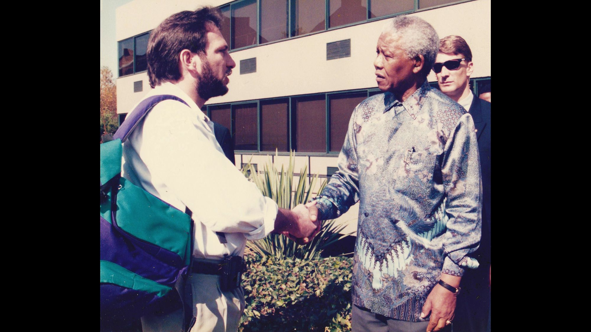 South African President Nelson Mandela shakes hands in 1998 with Tom Cohen, who was leaving South Africa after eight years as an Associated Press correspondent covering the nation's transition from apartheid to a multiracial democracy.