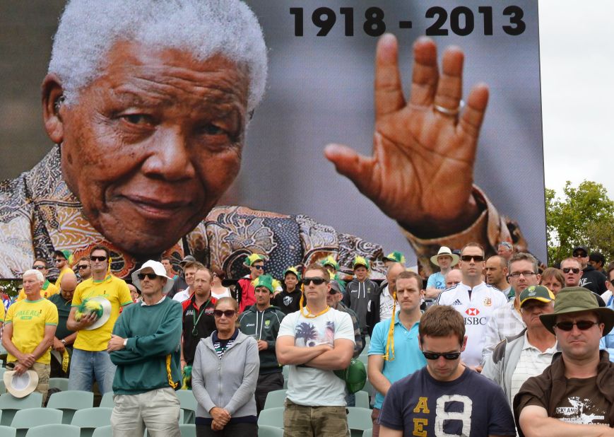 Australian and English cricket fans in Adelaide, Australia, observe a minute of silence December 6, to mark the passing of Nelson Mandela. 