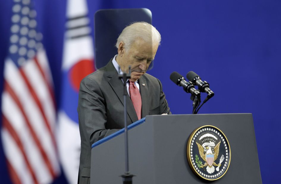 U.S. Vice President Joe Biden pays a silent tribute to Mandela before his speech on December 6 at Yonsei University in Seoul, South Korea.