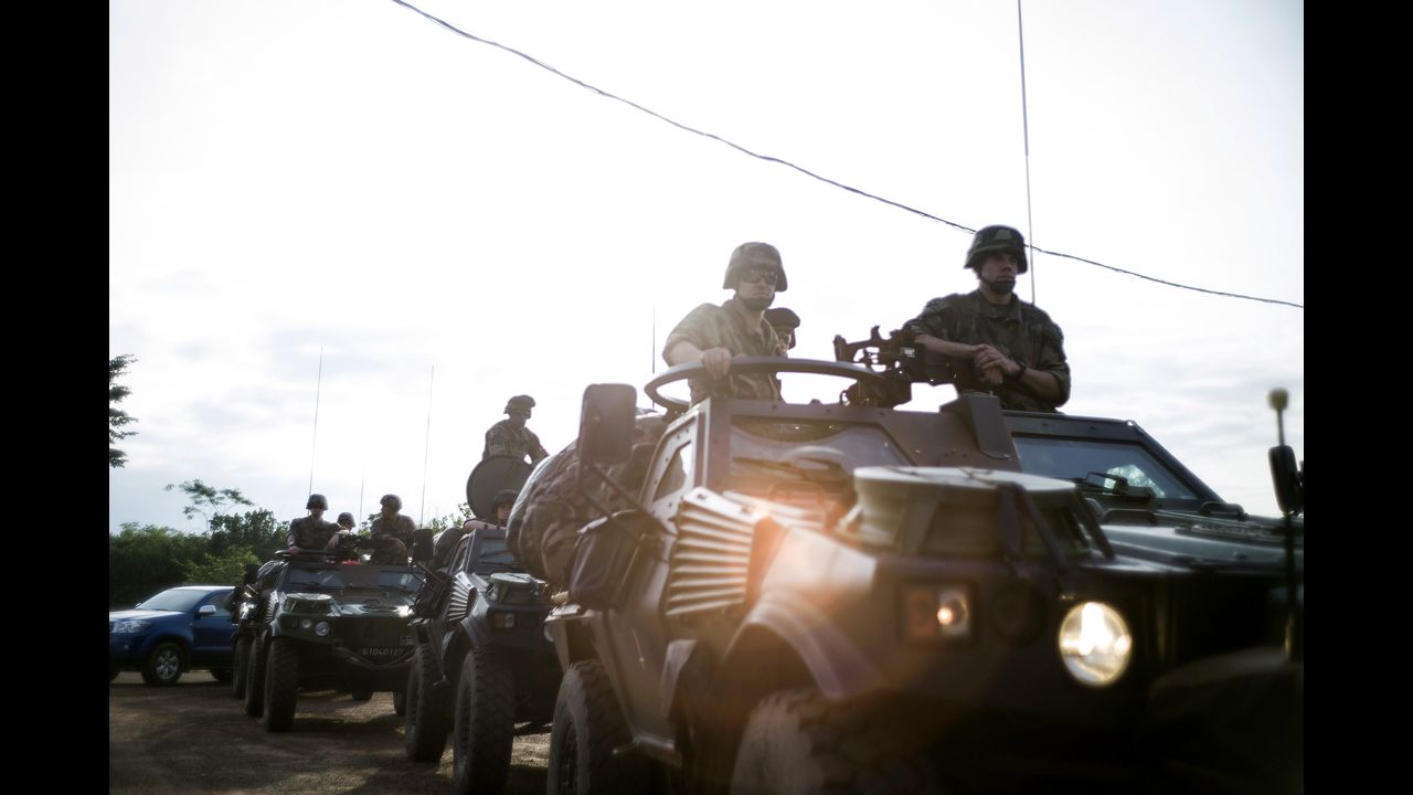 French military forces drive in Cameroon on December 5.