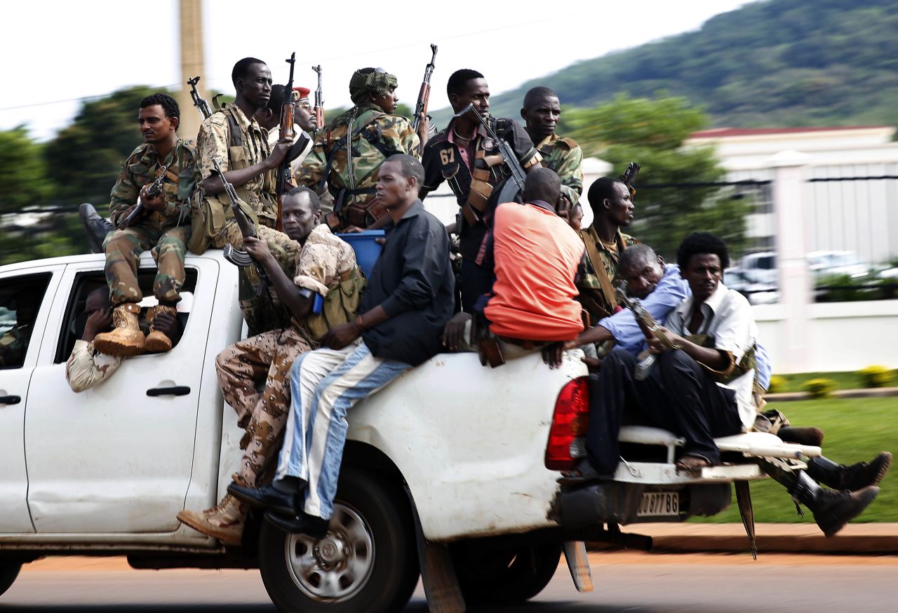Seleka soldiers race through Bangui as gunfire and mortar rounds erupt in the capital December 5.