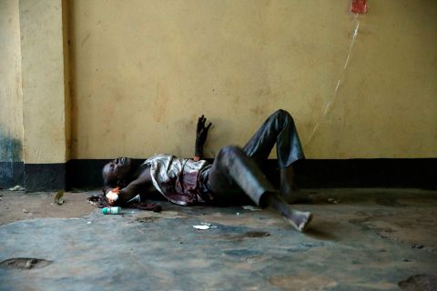 A severely wounded man lies unattended in a Bangui mosque December 5.