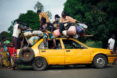 Christians from the village of Bouebou load up on a taxi as they flee violence on December 4.