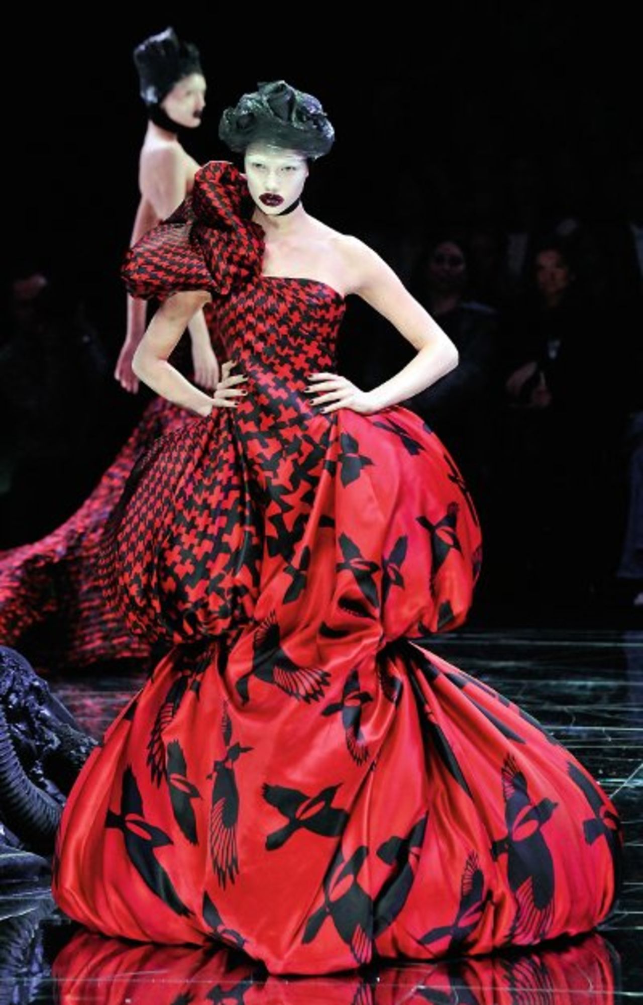 Even before high-profile showings at art fairs, designers have been drawing inspiration from and collaborated with artists for years. Alexander McQueen's theatrical runway shows blended art, music and film where viewers experienced far more than just a fashion presentation. Here, a model walks down the catwalk in a 2009 show in Paris.