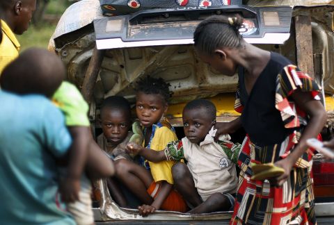 Christian children from Bouebou are packed in the trunk of a taxi as they flee violence December 4. 