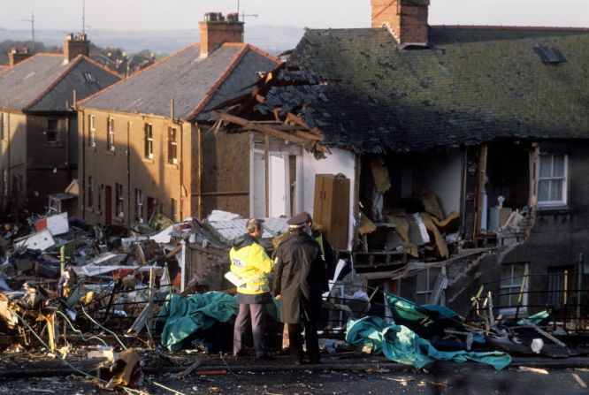 Investigators confer at the crash site two days after the tragedy. In July 1990, the British Civil Aviation Authority's Air Investigation Branch officially reported that an explosive device caused the crash.