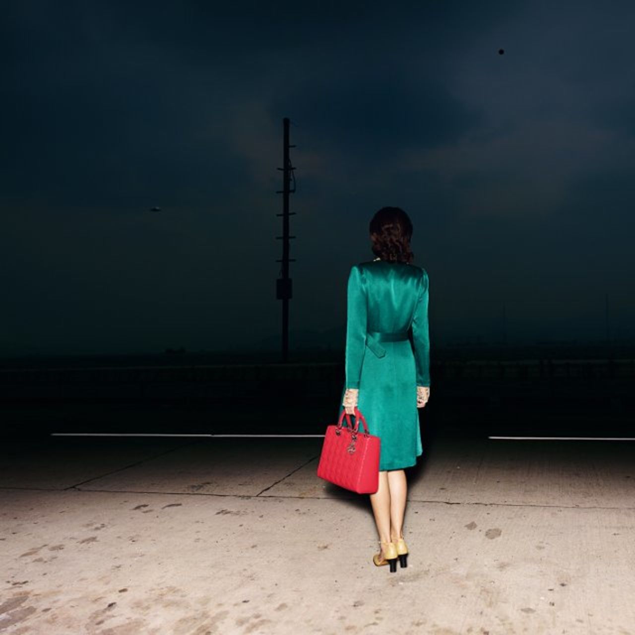 Quentin Shih became something of a regular contributor to the house of Dior, and also took this mysterious image titled <em>A Chinese Woman with a Lady Dior Handbag</em> in 2011.