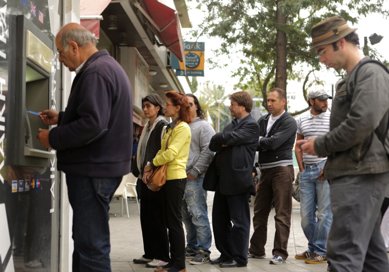 Cypriot residents queued at Laiki Bank -- the country's second largest bank -- to withdraw their savings during Cyprus' financial crisis. The bank ultimately collapsed in March 2013.  