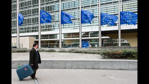 European Union flags fly at half-staff at the European Commission headquarters in Brussels, Belgium, on December 6.