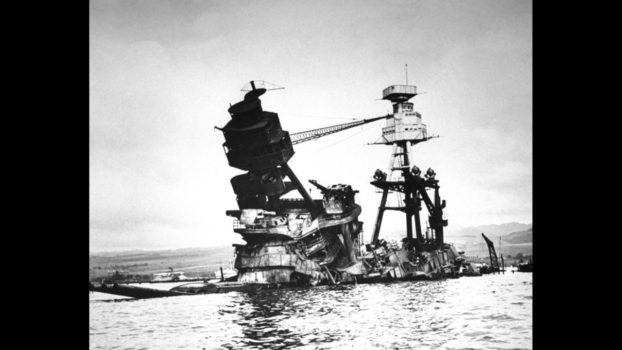Part of the wreckage of the USS Arizona is seen just above the water in Pearl Harbor in this previously unpublished LIFE photograph.