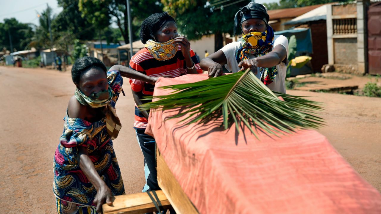 Women push a coffin in the streets of Bangui on December 7. Violence has raged in the Central African Republic since a coalition of rebels deposed President Francois Bozize in March, the latest in a series of coups since the nation gained independence.