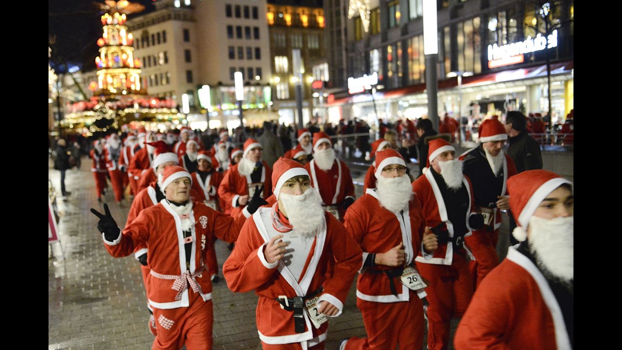 Runners dressed as Santa Claus take part in a Santa Run on December 6, in Hanover, Germany.