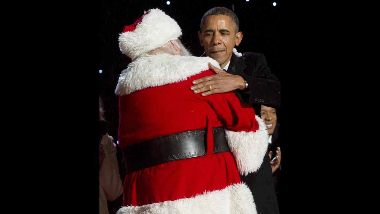 U.S. President Barack Obama hugs Santa Claus during the National Christmas Tree lighting ceremony on December 6.