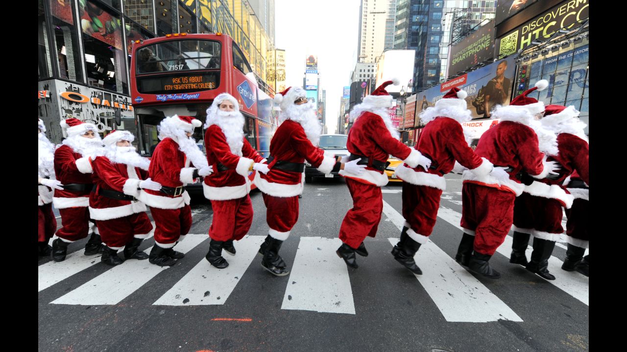 Santa Clauses bunny-hop through Times Square as they deliver holiday Peeps and spread cheer on December 4.