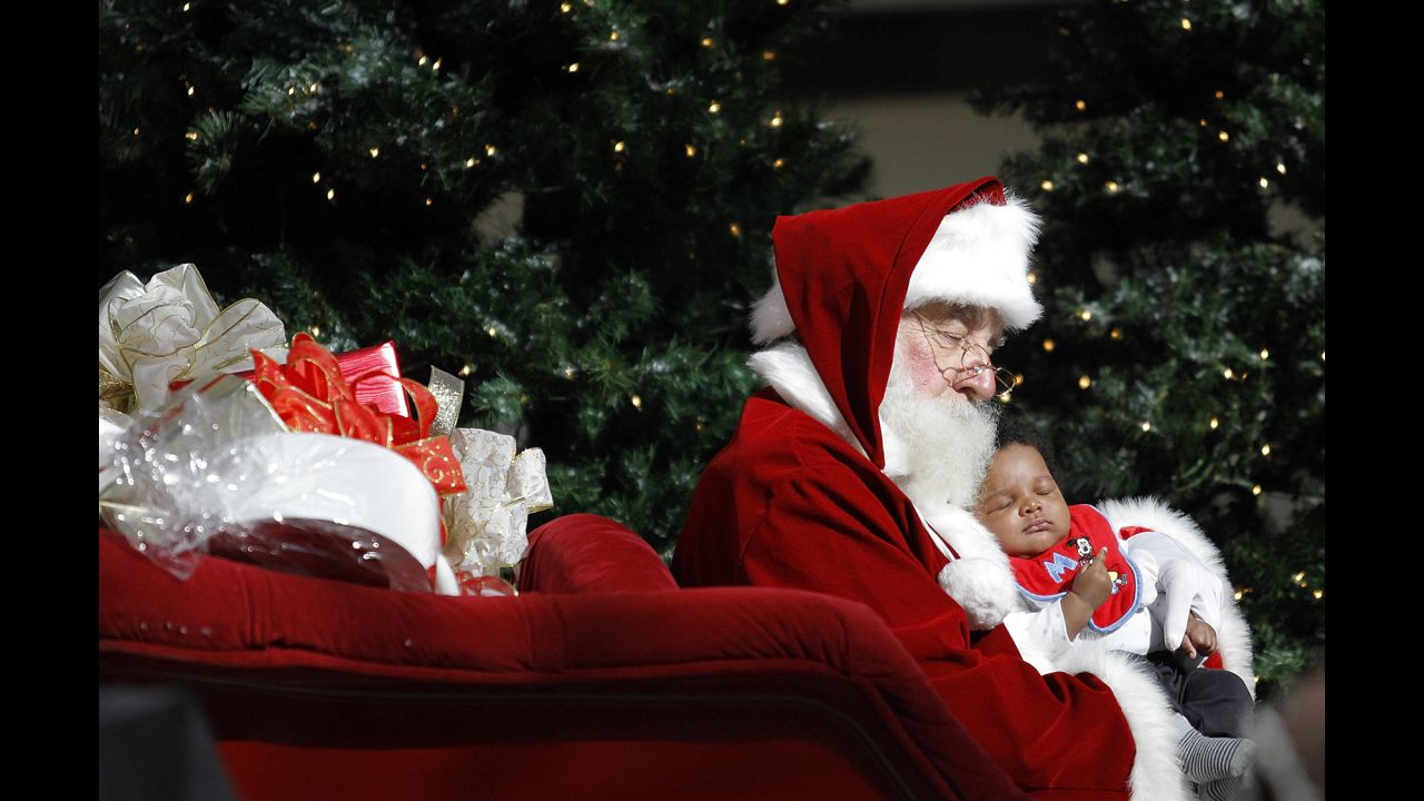 Santa and 2-month-old Ty'e Fishe have their picture taken November 29 at Lakeside Mall in Metairie, Louisiana.