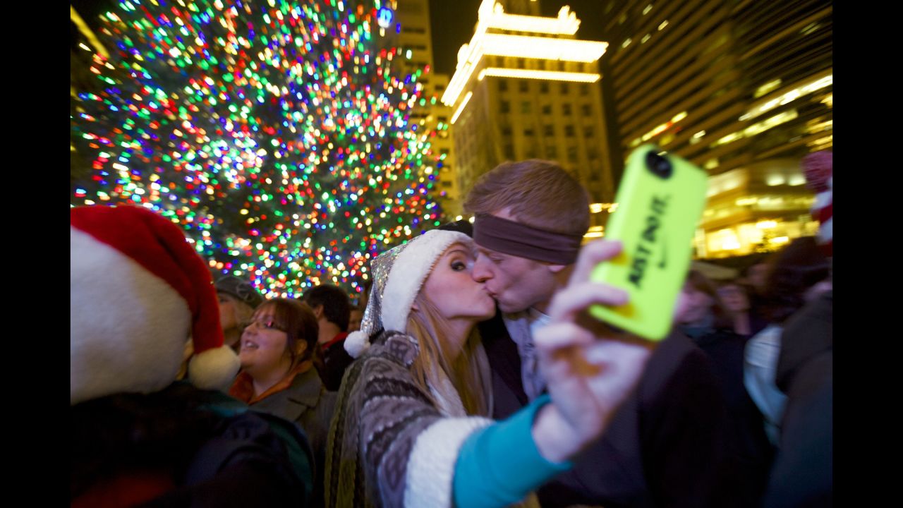 Savannah Rice snaps a picture with her boyfriend November 29 at Pioneer Courthouse Square in Portland, Oregon.