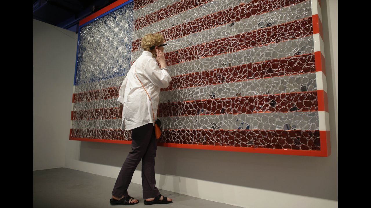 Jana Millstone, of Lancaster, Pennsylvania, wears Google Glass to view artwork titled "Viewpoints of Billions" by artist David Datuna, on December 7, in the Design District neighborhood of Miami. The piece is the first of a series which combines art and technology using Google Glass to create an interactive experience.