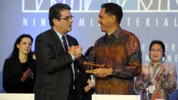 Indonesia's Trade Minister Gita Wirjawan (R) shakes hands with WTO Director General Roberto Azevedo (L) after the final agreement before the closing ceremony of the WTO (World Trade Organisation) conference in Nusa Dua, on Indonesian resort island of Bali on December 7, 2013. AFP PHOTO/Sonny Tumbelaka (Photo credit should read SONNY TUMBELAKA/AFP/Getty Images)