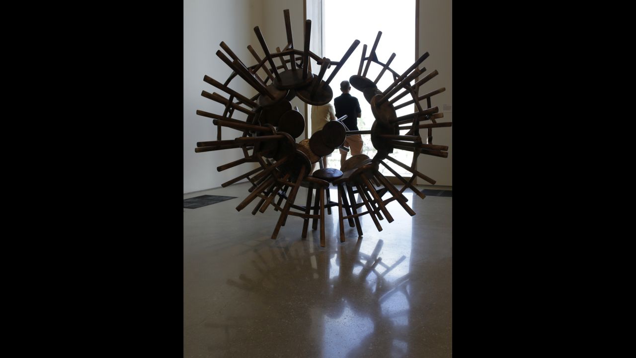 A sculpture by the Chinese artist Ai Weiwei, titled "Grapes," features 40 antique wooden stools from the Qing Dynasty, and is on display  at the Perez Art Museum Miami on December 7.
