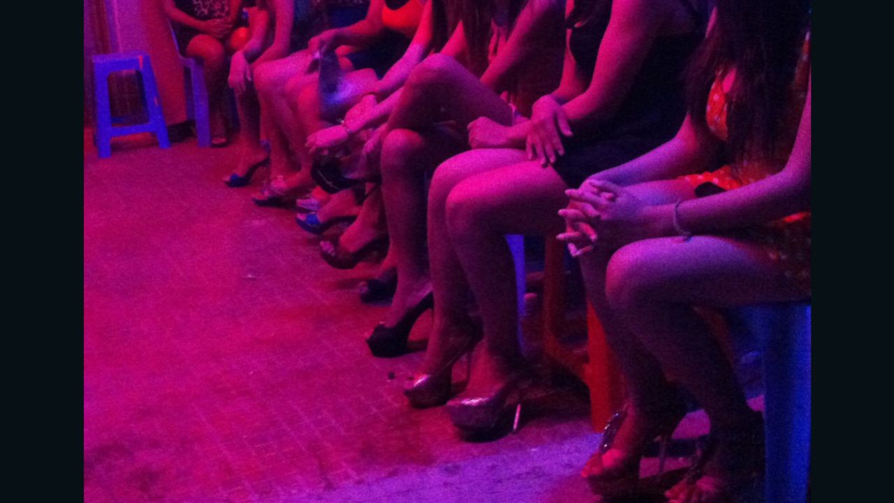 Women line outside a Phnom Penh karaoke bar where sex is sold. There are many such establishments on the road to Svay Pak, on the outskirts of the Cambodian capital.
