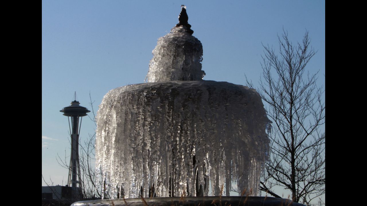 A fountain stands frozen in Chandler's Cove at South Lake Union in Seattle on Friday, December 6. 